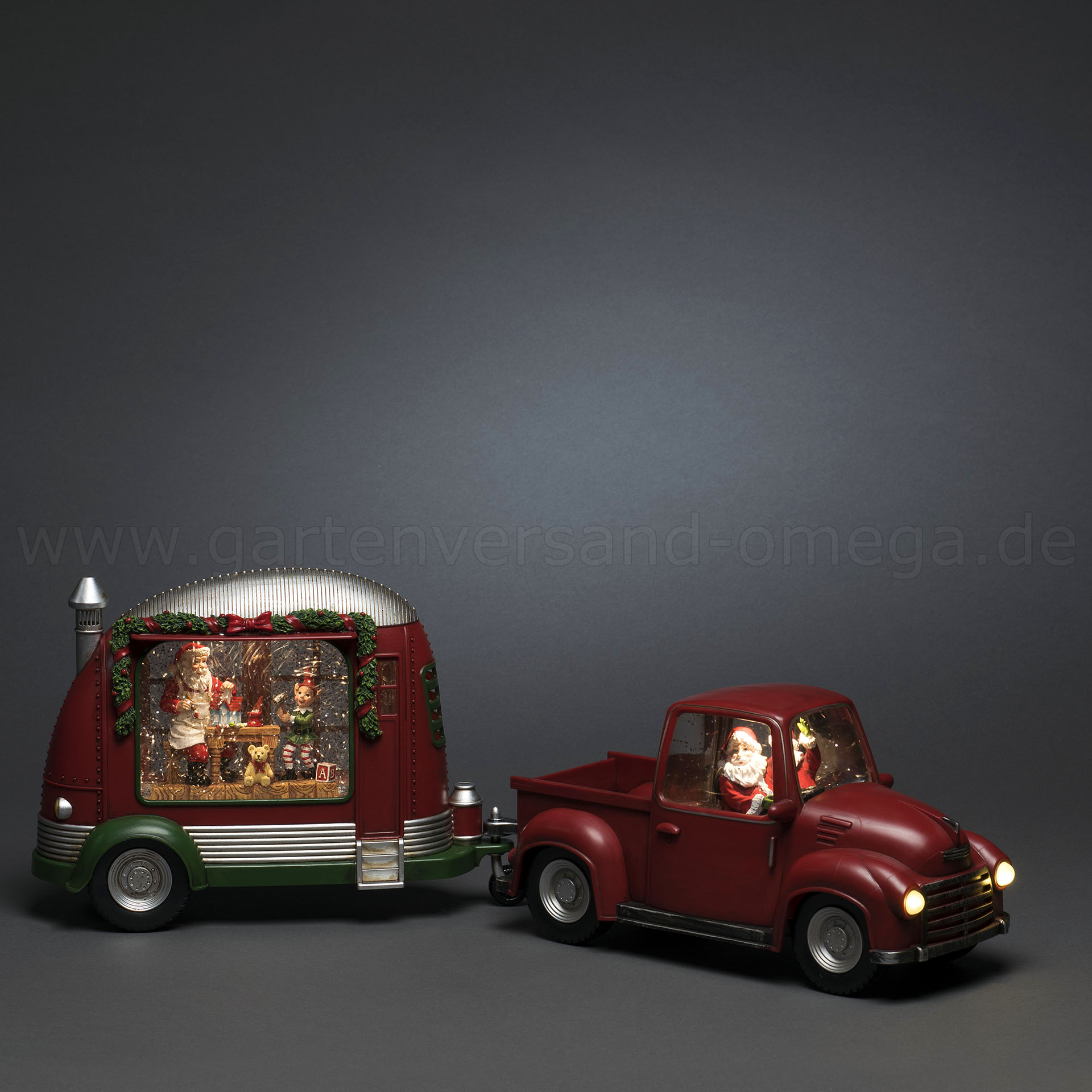 Die wassergefüllte Weihnachtsdekoration Wohnwagen (Caravan) kombiniert mit wassergefüllter Weihnachtsdeko Pick-up mit Weihnachtsmann